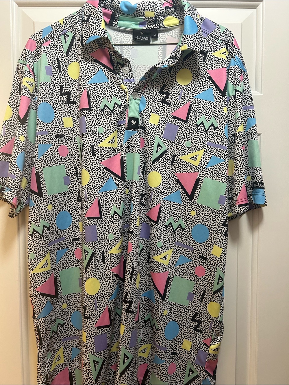 Bad Birdie Pastel Geo Print Polo in Pink, Blue, Yellow, Green, Purple, Black